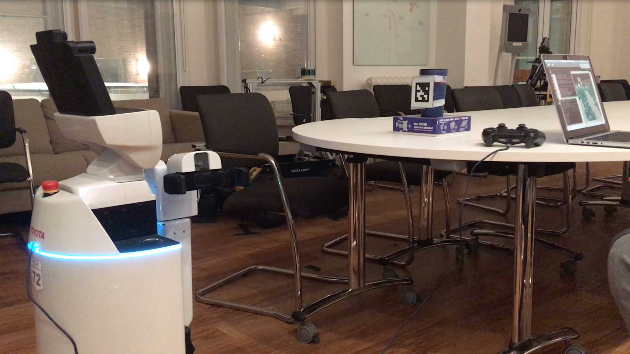 A robot in an empty conference room at Oxford's Department of Engineering Sciences