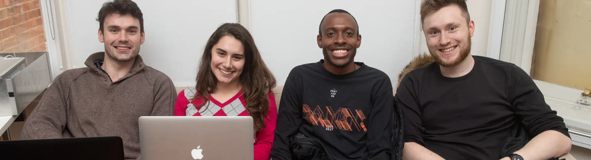 Researchers smiling for the camera during Robotics week