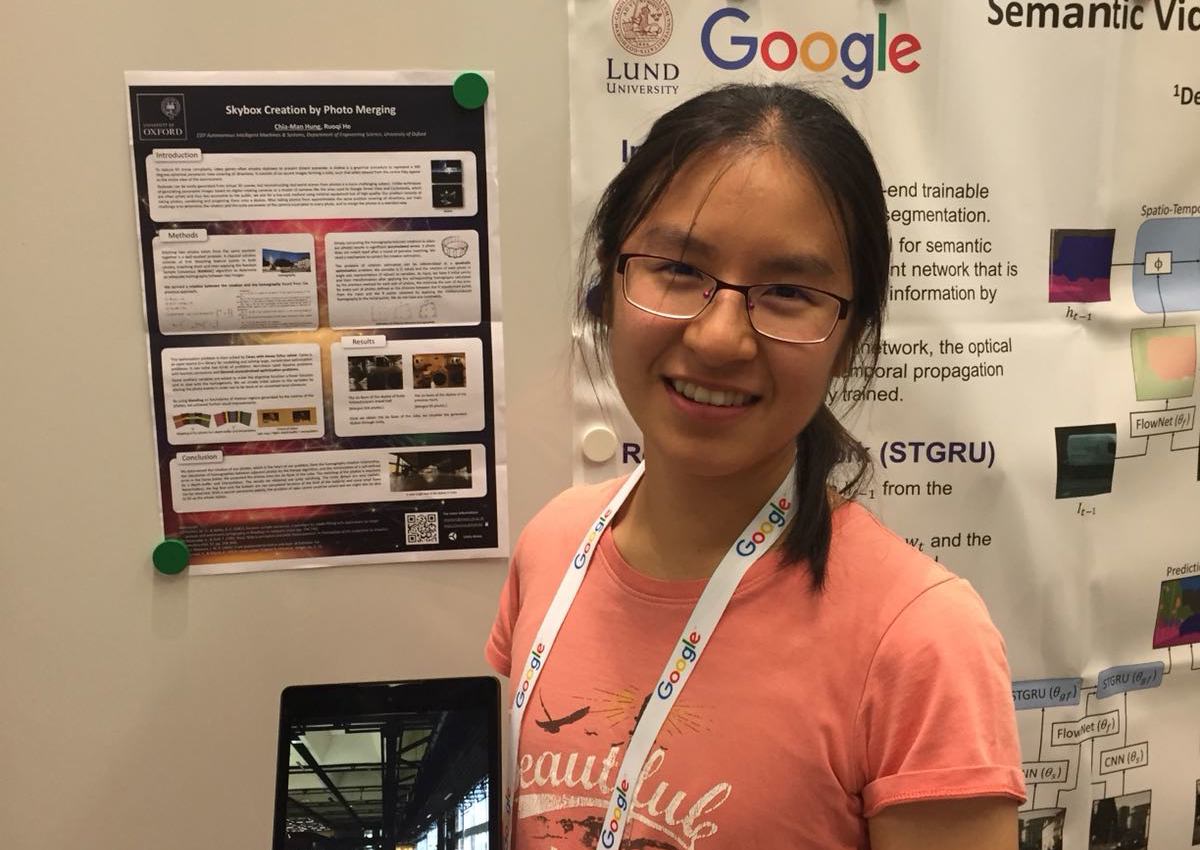 researcher showcasing her research poster at Google
