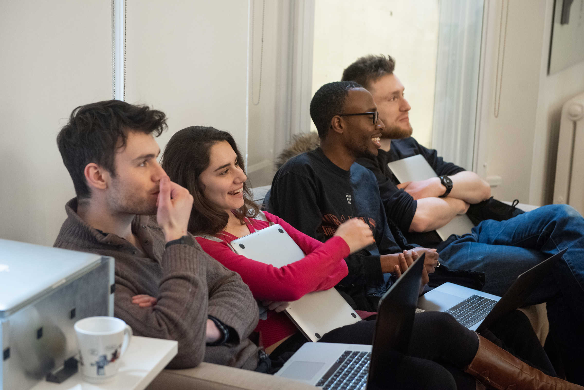 Researchers smiling for the camera during Robotics week