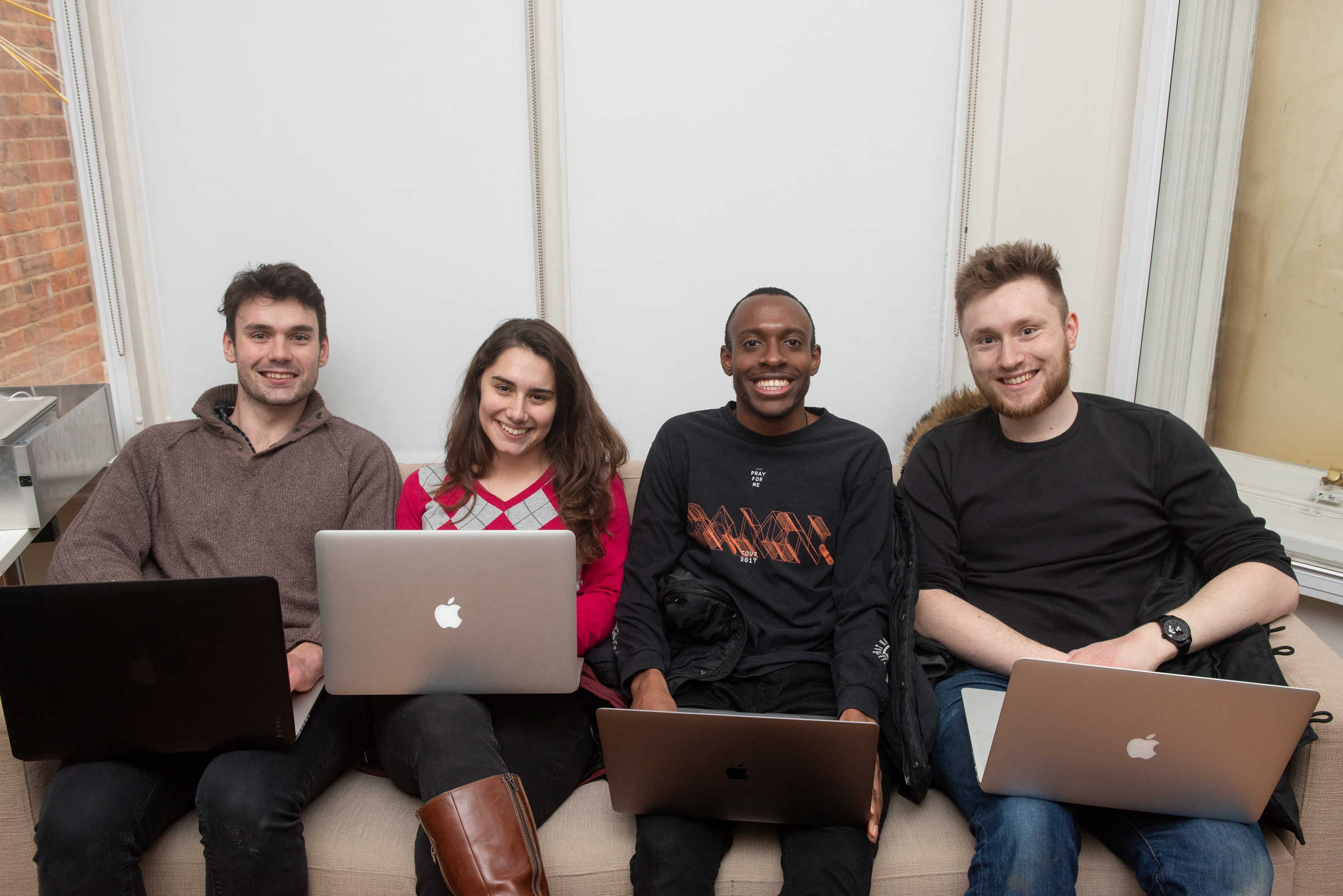 Researchers smiling for the camera during Robotics week