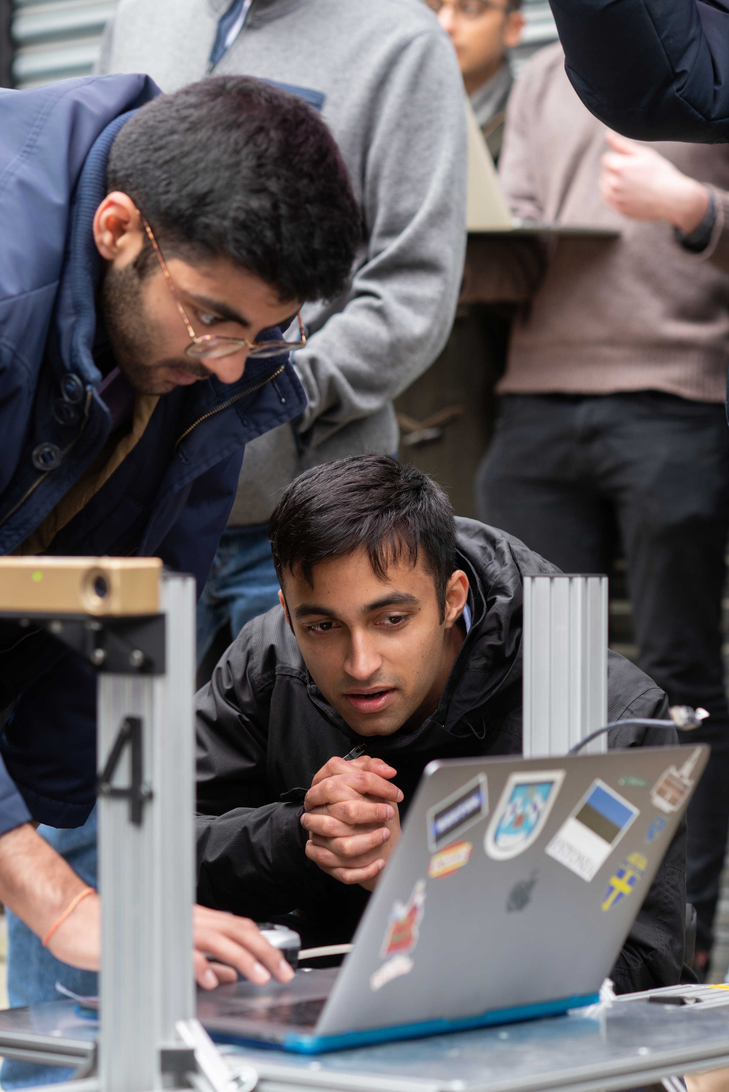 Prannay Kaul and Shaan Desai working on a Husky in Mobile Robotics Week